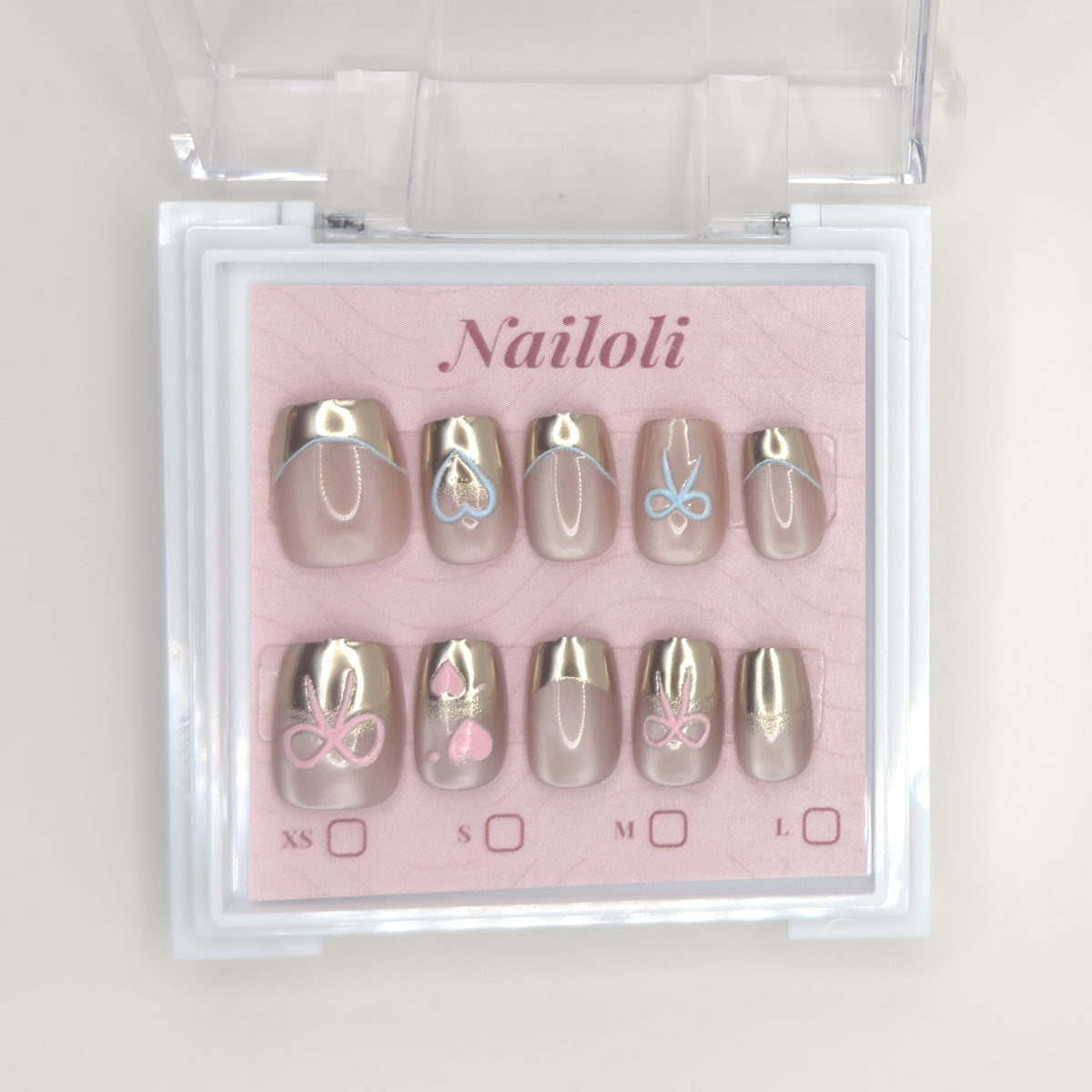 Champagne chrome set on its backing card inside the open clear Nailoli case