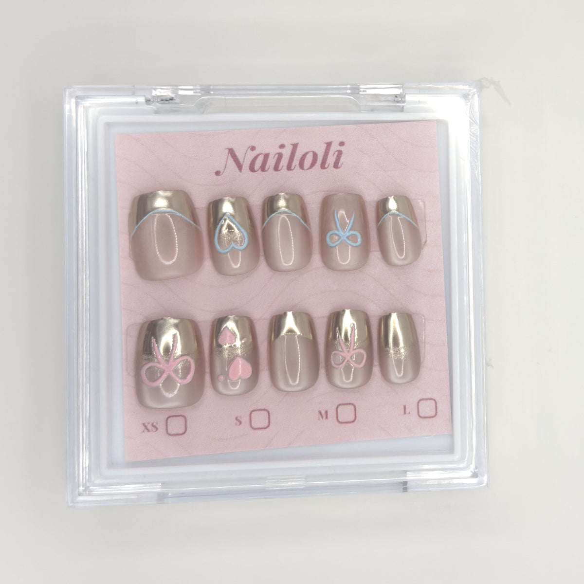 Champagne chrome set inside the closed clear Nailoli case