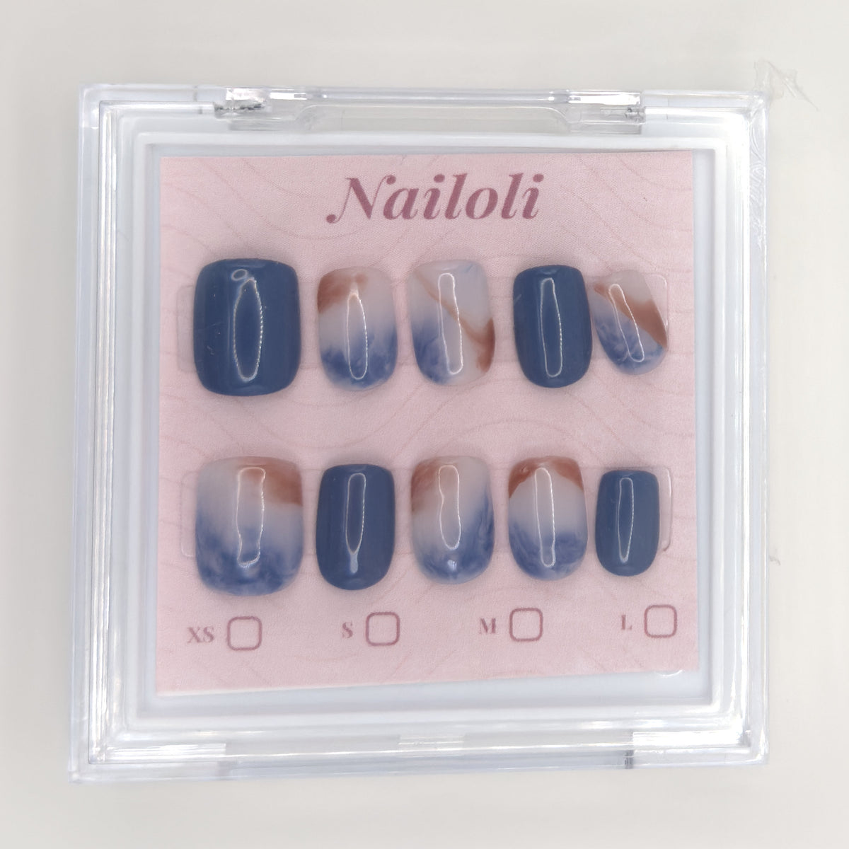Ocean marble set on its backing card inside the closed clear Nailoli case