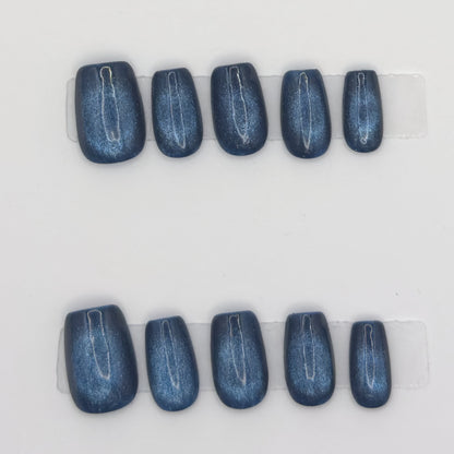 10 midnight cat eye square press-ons in two rows, showing the magnetic chrome line on each nail