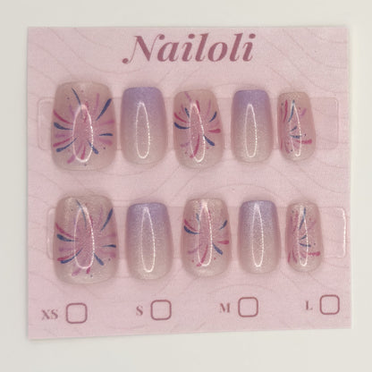 Lavender starburst nails on the pink Nailoli backing card with XS, S, M, and L size boxes