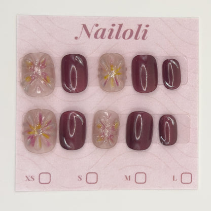 Mauve blossom nails on the pink Nailoli backing card with XS, S, M, and L size boxes