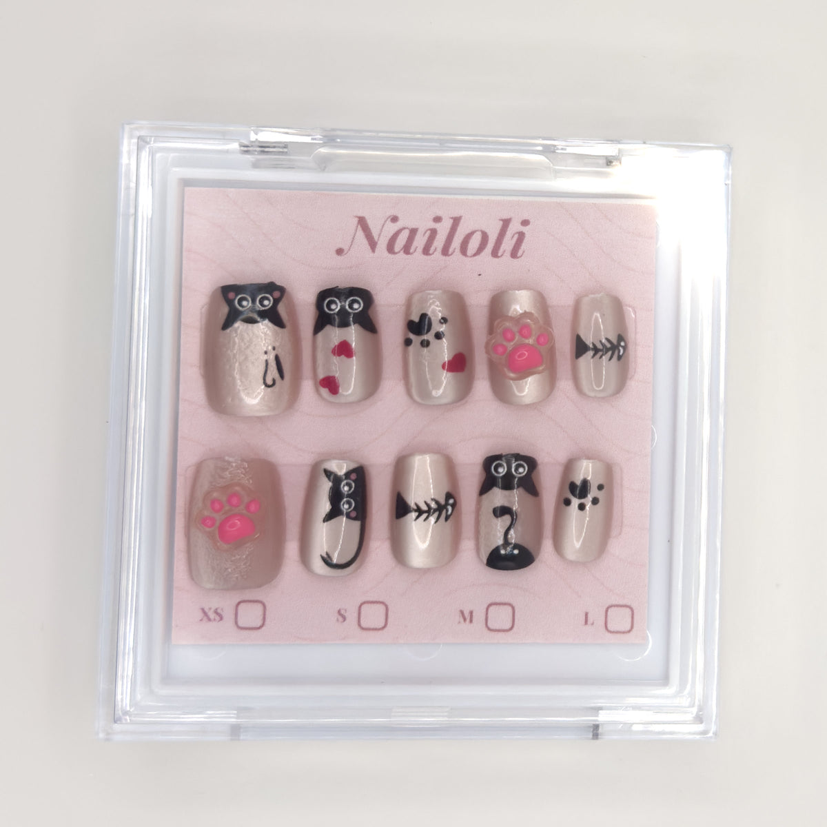 Kawaii cat set inside the closed clear Nailoli case