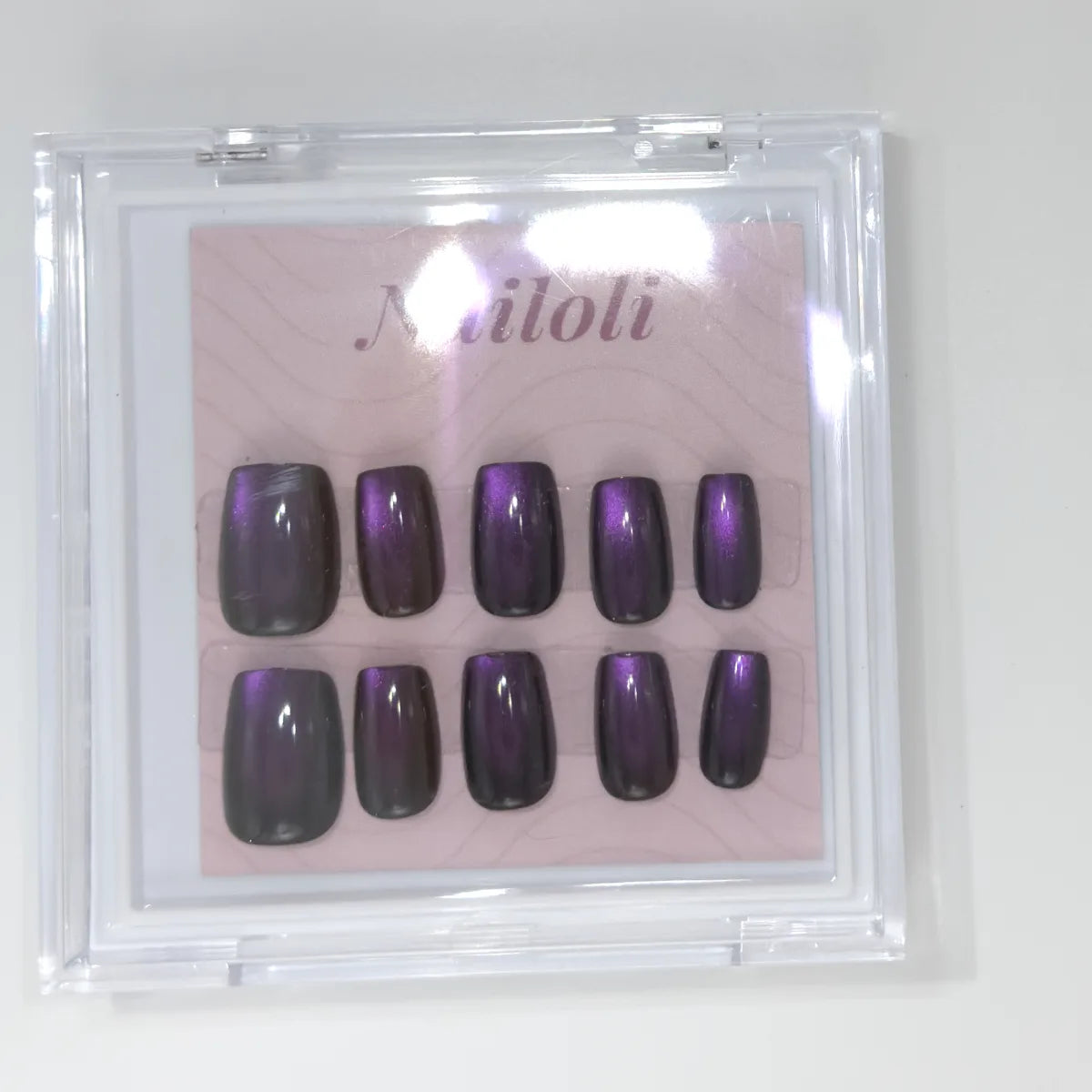 Blackberry square set inside the closed clear Nailoli case