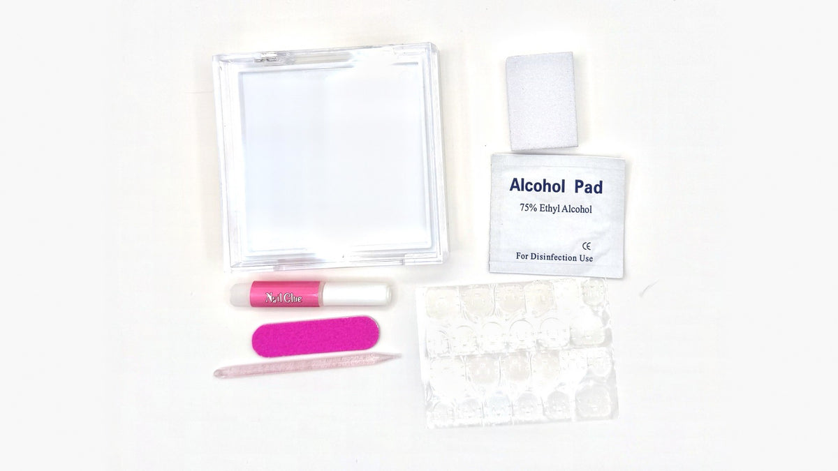 Nailoli application kit: nail glue, adhesive tabs, nail file, buffing block, cuticle pusher, alcohol pad, and case